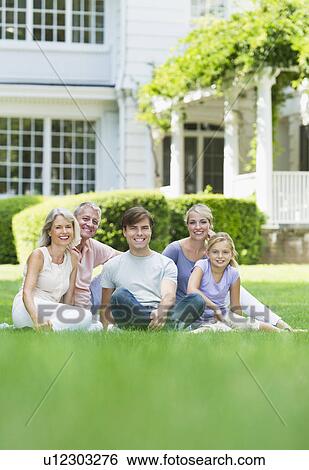 Stock Photograph - Portrait of girl (10-11) with parents and grandparents. Fotosearch