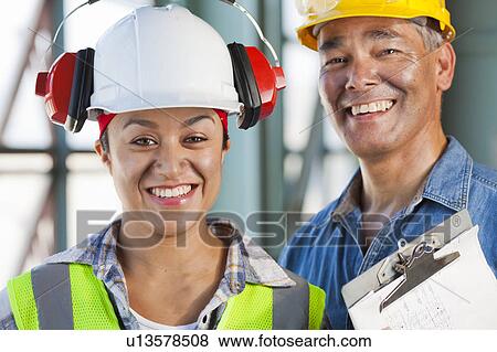 Portrait of male and female manual workers View Large Photo Image Stock Photo - Portrait of male and female manual workers. Fotosearch