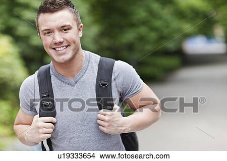 Picture - Portrait of male college student smiling. Fotosearch