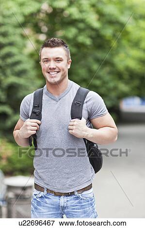 Stock Photo - Portrait of male college student smiling. Fotosearch