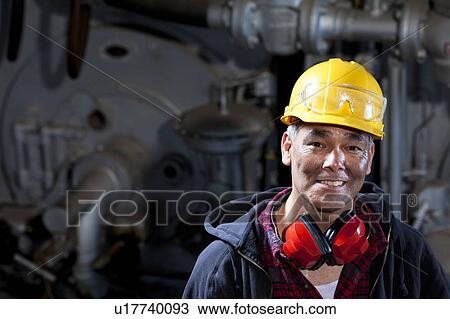 Portrait of male manual worker wearing hardhat View Large Photo Image Stock Image - Portrait of male manual worker wearing hardhat. Fotosearch