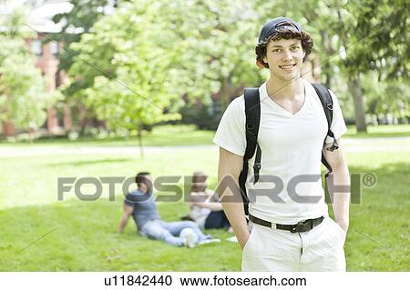Stock Image - Portrait of male student on campus. Fotosearch