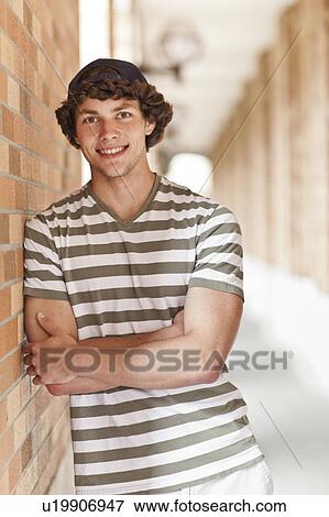 Stock Photo - Portrait of man in corridor. Fotosearch