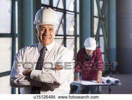 Portrait of man wearing tie and hardhat View Large Photo Image Stock Photography - Portrait of man wearing tie and hardhat. Fotosearch