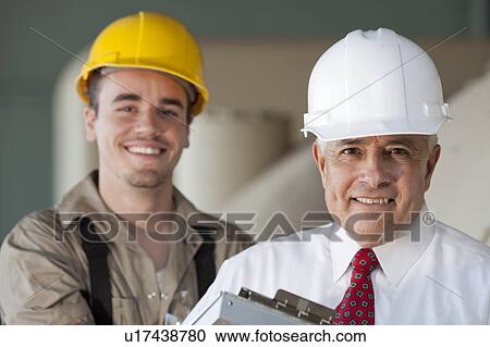Portrait of manual worker and manager View Large Photo Image Stock Image - Portrait of manual worker and manager. Fotosearch