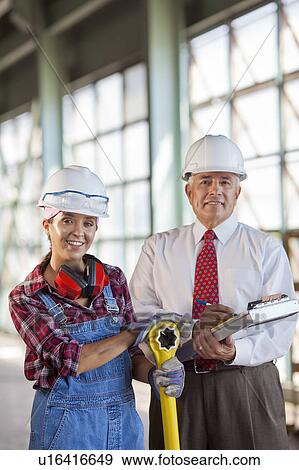 Portrait of manual worker and manager View Large Photo Image Stock Photo - Portrait of manual worker and manager. Fotosearch