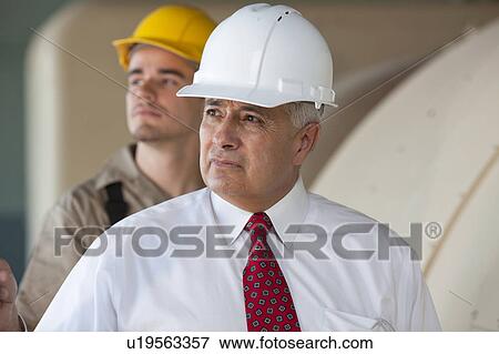 Portrait of manual worker and manager View Large Photo Image Stock Photo - Portrait of manual worker and manager. Fotosearch
