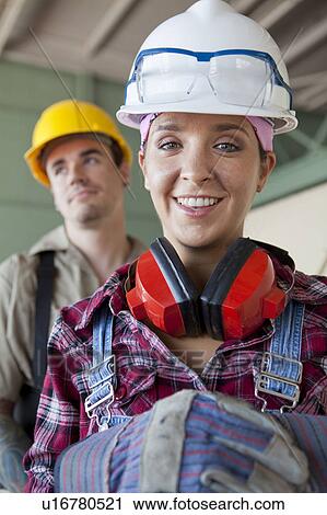 Portrait of manual workers wearing hardhats View Large Photo Image Stock Image - Portrait of manual workers wearing hardhats. Fotosearch