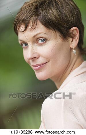 Stock Photo - Portrait of mature woman smiling. Fotosearch