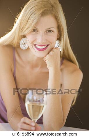 Picture - Portrait of mid adult woman drinking wine. Fotosearch
