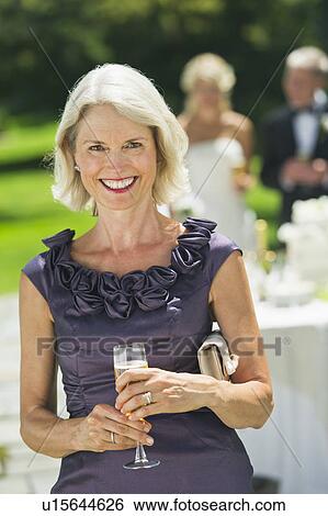 Portrait of mother of bride at wedding reception View Large Photo Image Stock Photograph - Portrait of mother of bride at wedding reception. Fotosearch
