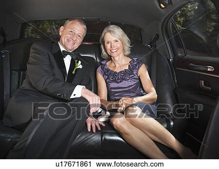 Stock Image - Portrait of parents of bride in limousine. Fotosearch