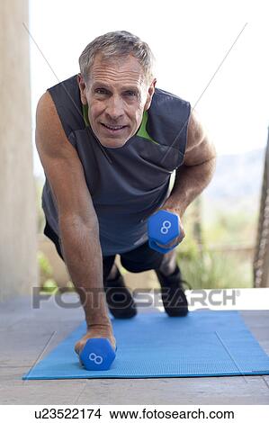 Portrait of senior man doing push-ups View Large Photo Image Picture - Portrait of senior man doing push-ups. Fotosearch