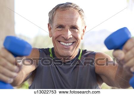 Portrait of senior man lifting dumbbells View Large Photo Image Stock Image - Portrait of senior man lifting dumbbells. Fotosearch