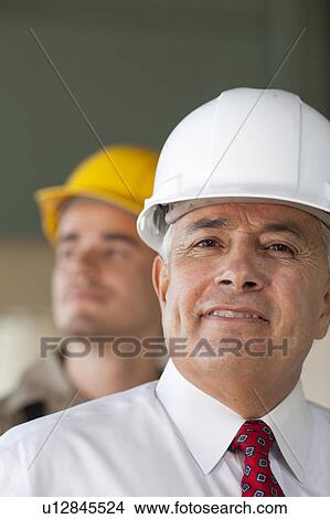 Portrait of senior man wearing tie and hardhat View Large Photo Image Picture - Portrait of senior man wearing tie and hardhat. Fotosearch