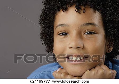 Portrait of smiling boy (8-9), studio shot View Large Photo Image Stock Photo - Portrait of smiling boy (8-9), studio shot. Fotosearch