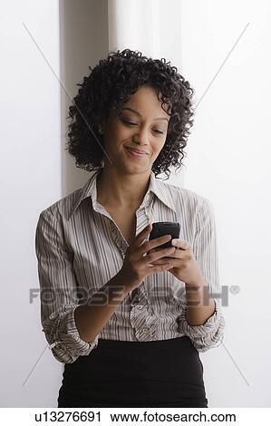 Portrait of smiling businesswoman on phone View Large Photo Image Stock Image - Portrait of smiling businesswoman on phone. Fotosearch