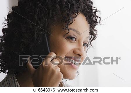 Portrait of smiling businesswoman on phone View Large Photo Image Stock Photograph - Portrait of smiling businesswoman on phone. Fotosearch