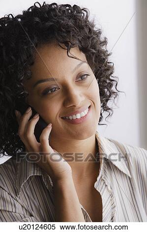 Portrait of smiling businesswoman on phone View Large Photo Image Stock Photography - Portrait of smiling businesswoman on phone. Fotosearch
