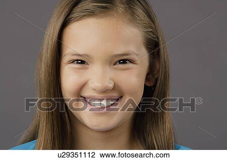 Portrait of smiling girl (8-9), studio shot View Large Photo Image Stock Image - Portrait of smiling girl (8-9), studio shot. Fotosearch
