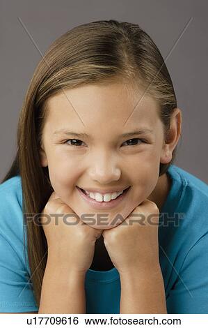 Portrait of smiling girl (8-9), studio shot View Large Photo Image Stock Photograph - Portrait of smiling girl (8-9), studio shot. Fotosearch