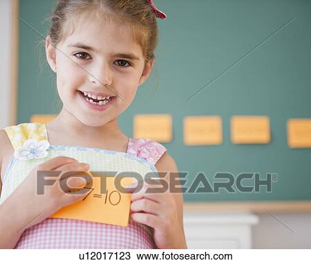 Stock Image - Portrait of smiling schoolgirl ( 6-7). Fotosearch
