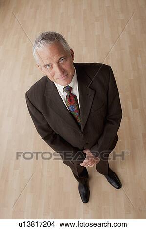 Portrait of smiling senior businessman View Large Photo Image Picture - Portrait of smiling senior businessman. Fotosearch