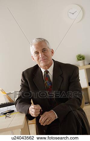 Portrait of smiling senior businessman View Large Photo Image Stock Image - Portrait of smiling senior businessman. Fotosearch