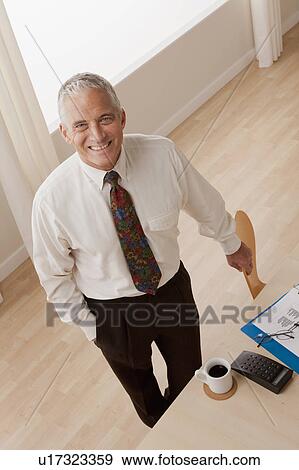 Stock Photo - Portrait of smiling senior businessman. Fotosearch
