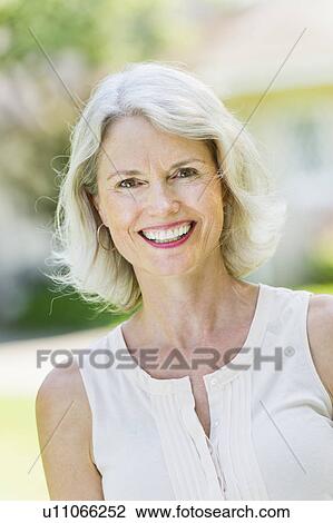 Portrait of smiling senior woman View Large Photo Image Stock Image - Portrait of smiling senior woman. Fotosearch