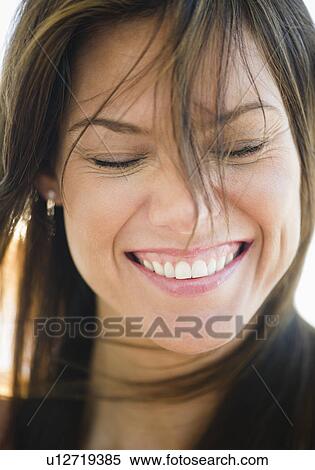 Portrait of smiling woman with eyes closed View Large Photo Image Stock Photography - Portrait of smiling woman with eyes closed. Fotosearch