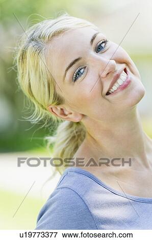 Stock Photo - Portrait of smiling young woman. Fotosearch