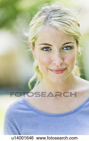 Portrait of smiling young woman View Large Photo Image Stock Photograph - Portrait of smiling young woman. Fotosearch
