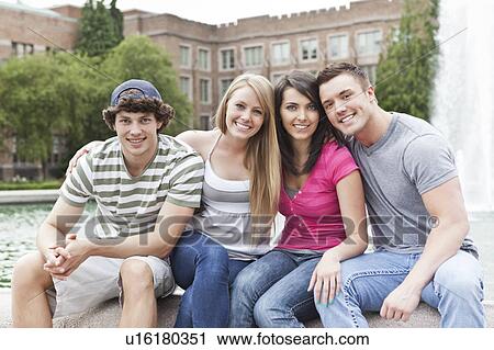 Portrait of two couples sitting at fountain View Large Photo Image Stock Image - Portrait of two couples sitting at fountain. Fotosearch