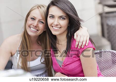 Portrait of two women embracing View Large Photo Image Stock Photo - Portrait of two women embracing. Fotosearch