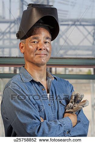 Stock Image - Portrait of welder. Fotosearch