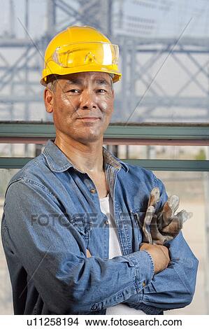 Portrait of worker wearing hardhat View Large Photo Image Picture - Portrait of worker wearing hardhat. Fotosearch