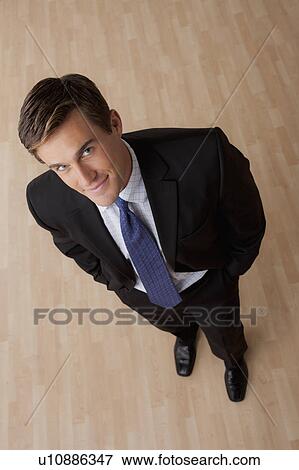 Stock Photo - Portrait of young businessman smiling. Fotosearch
