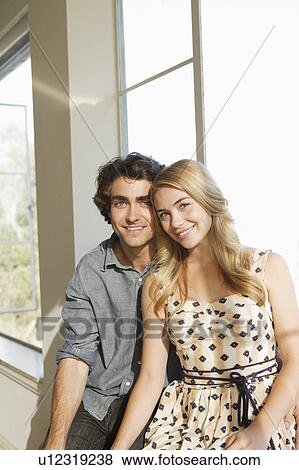 Portrait of young couple at home View Large Photo Image Stock Photo - Portrait of young couple at home. Fotosearch