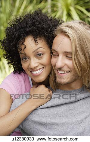 Stock Image - Portrait of young couple. Fotosearch