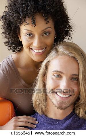 Stock Image - Portrait of young couple. Fotosearch