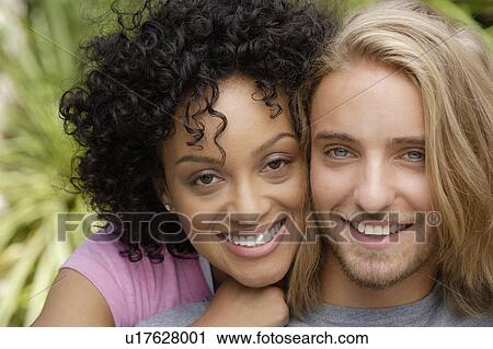 Stock Image - Portrait of young couple. Fotosearch
