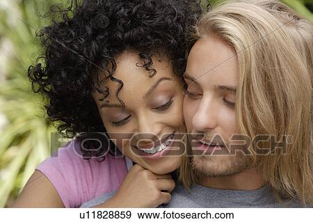 Stock Photo - Portrait of young couple. Fotosearch