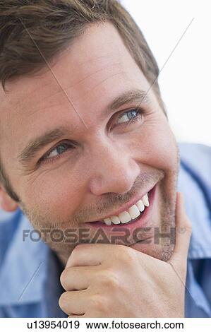 Stock Photo - Portrait of young man smiling. Fotosearch