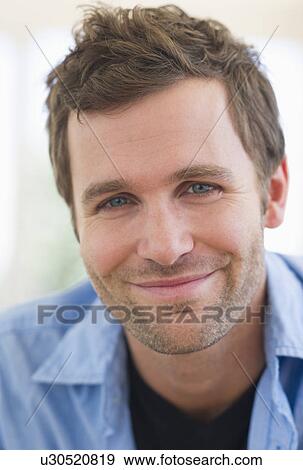 Stock Photo - Portrait of young man smiling. Fotosearch