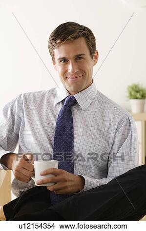 Portrait of young smiling businessman View Large Photo Image Picture - Portrait of young smiling businessman. Fotosearch
