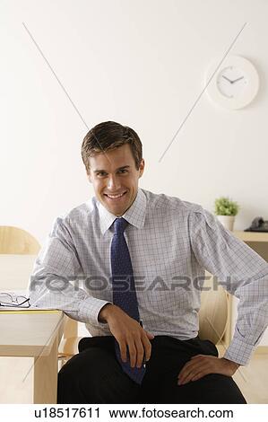 Portrait of young smiling businessman View Large Photo Image Stock Image - Portrait of young smiling businessman. Fotosearch