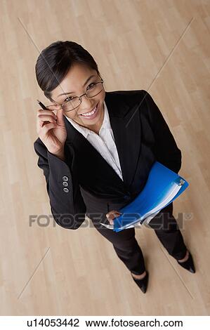 Portrait of young smiling businesswoman View Large Photo Image Stock Image - Portrait of young smiling businesswoman. Fotosearch