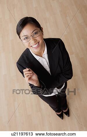 Portrait of young smiling businesswoman View Large Photo Image Stock Image - Portrait of young smiling businesswoman. Fotosearch