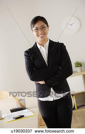 Stock Photo - Portrait of young smiling businesswoman. Fotosearch